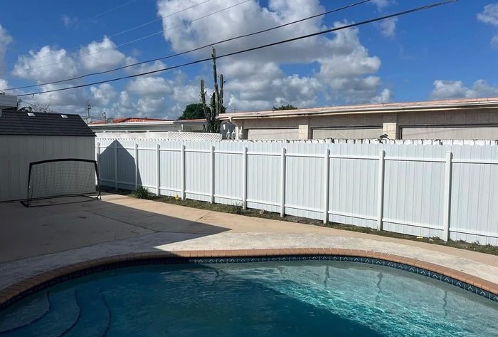 Durafence privacy panels around a pool in South Florida.